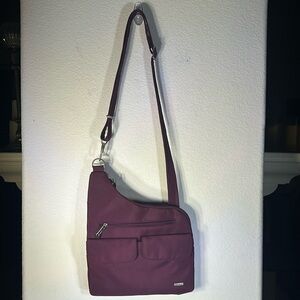 Travelon purple crossbody. Never worn. Good travel travel bag.